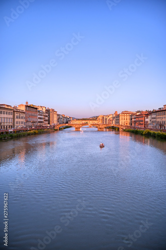 A view of the Arno River and the Ponte Vecchio in Florence, Italy. © Jbyard