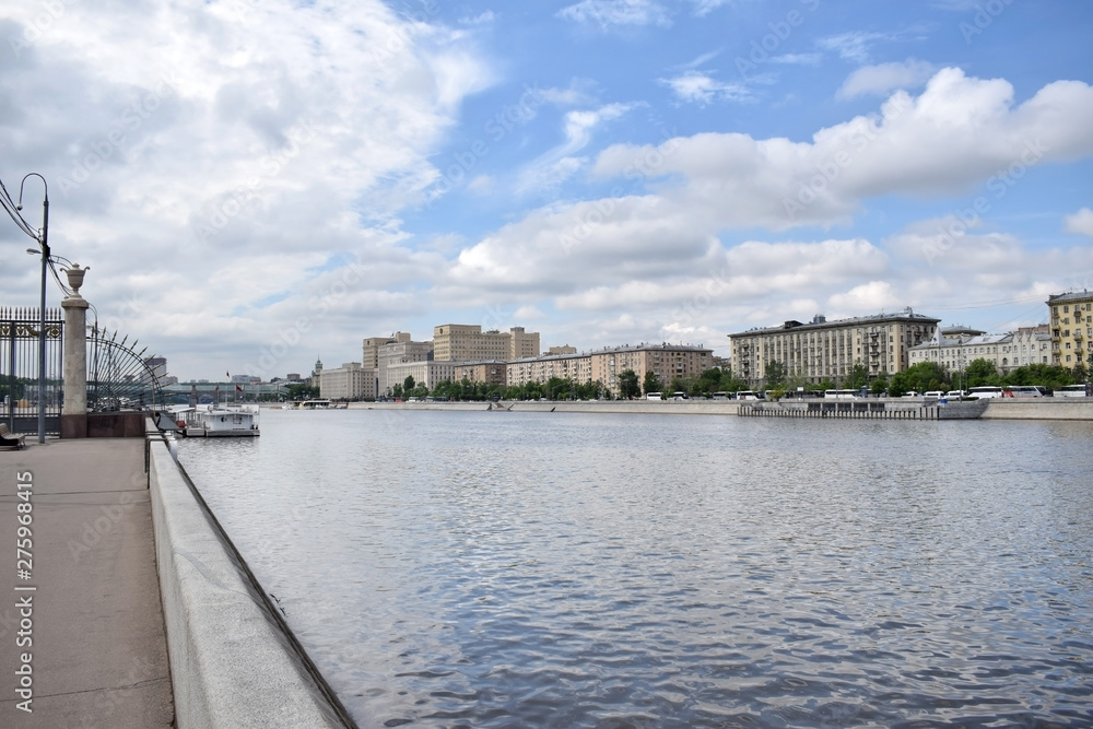 Moscow, Russia - May 13, 2019: The view from the Krymskaya embankment to the Moskva river and Frunzenskaya embankment against the blue sky with clouds