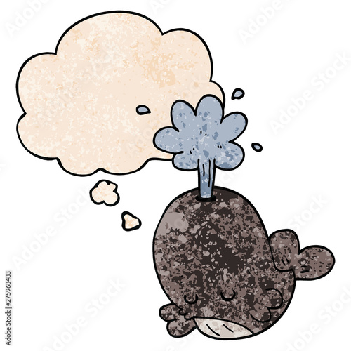 cartoon spouting whale and thought bubble in grunge texture pattern style