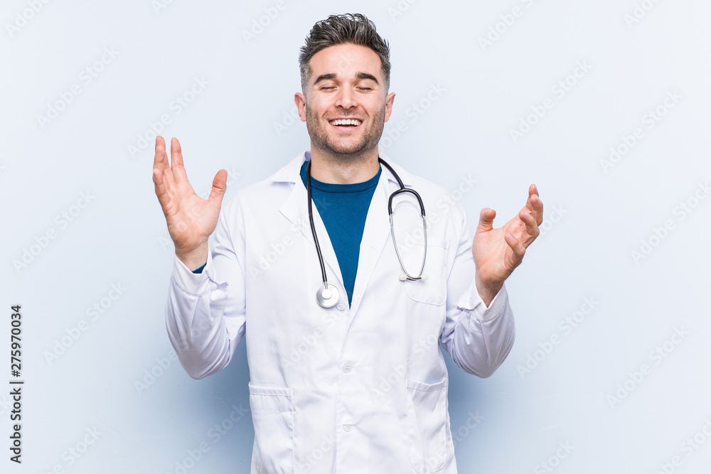 Young handsome doctor man joyful laughing a lot. Happiness concept. Young handsome doctor man joyful laughing a lot. Happiness concept.