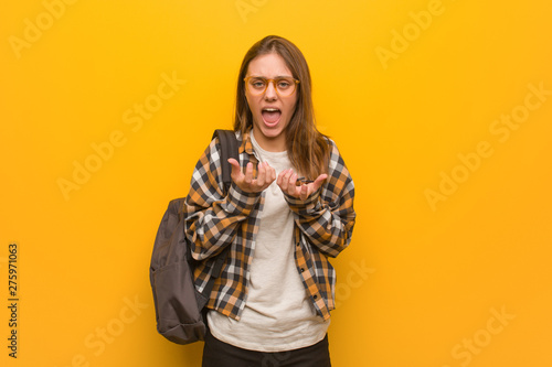 Young student woman very scared and afraid