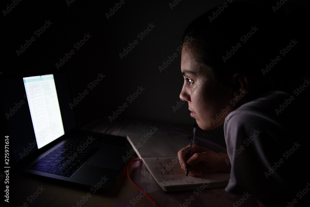 woman working at home on laptop in bed woman working at home on laptop in bed