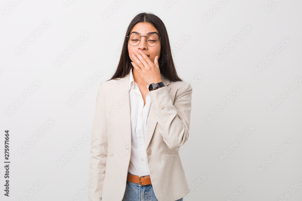 Young business arab woman isolated against a white background yawning showing a tired gesture covering mouth with hand. Young business arab woman isolated against a white background yawning showing a tired gesture covering mouth with hand.
