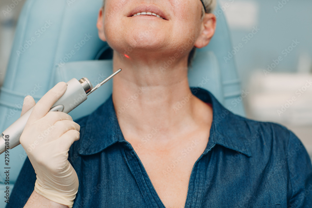 Laser cosmetology concept. Removal of age spots by laser. Laser cosmetology concept. Removal of age spots by laser.