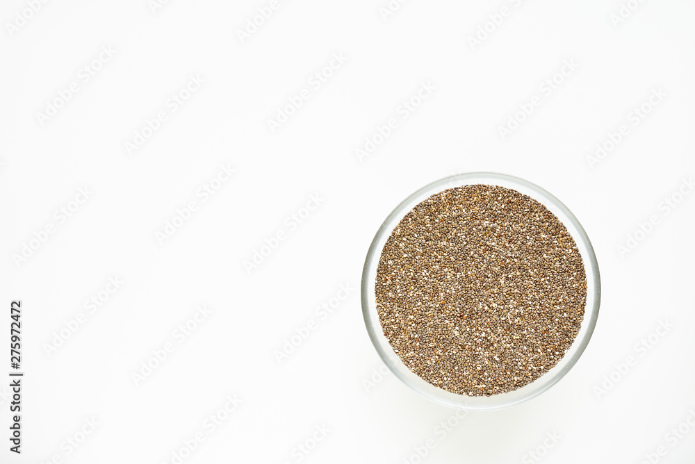 chia seeds in a bowl on a white background chia seeds in a bowl on a white background