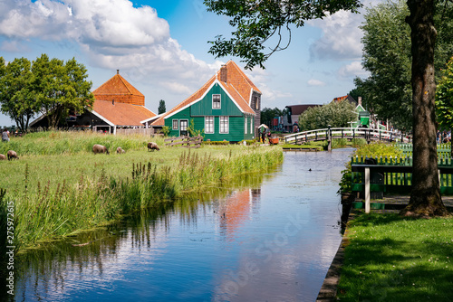 Old dutch green traditional houses in town Zaanse Schans in Netherlands, North Holland near Amsterdam