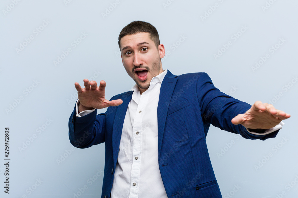 Young business caucasian man being shocked due to an imminent danger Young business caucasian man being shocked due to an imminent danger