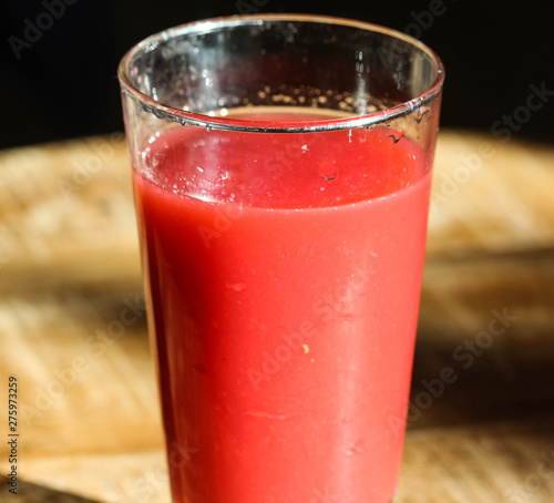 glass with strawberry, raspberry, and apple smoothie