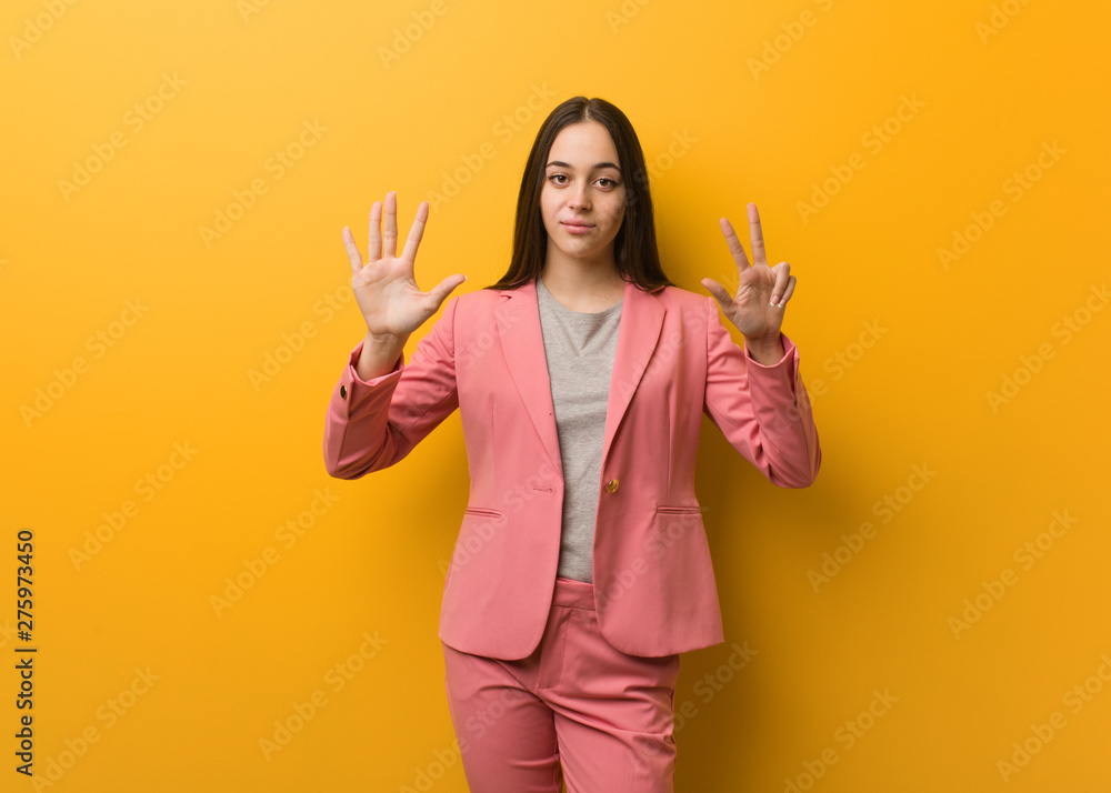 Young modern business woman showing number eight Young modern business woman showing number eight