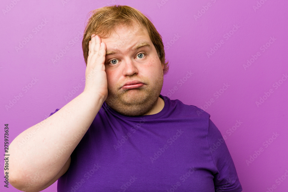 Young authentic redhead fat man tired and very sleepy keeping hand on head. Young authentic redhead fat man tired and very sleepy keeping hand on head.