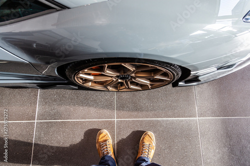 at the foot of a supercars