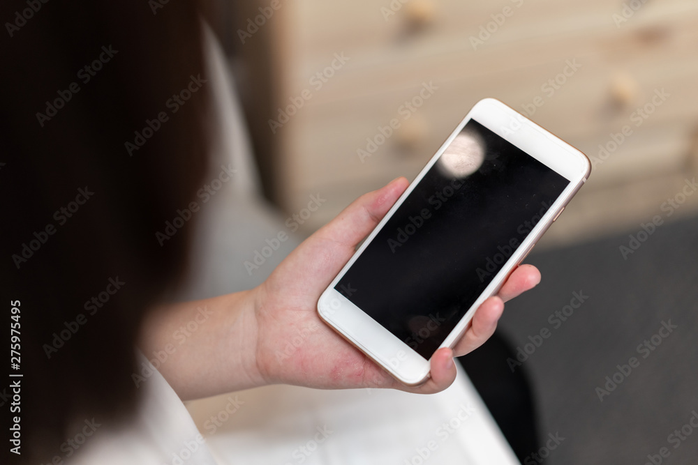 Girl pointing finger on screen smartphone Girl pointing finger on screen smartphone