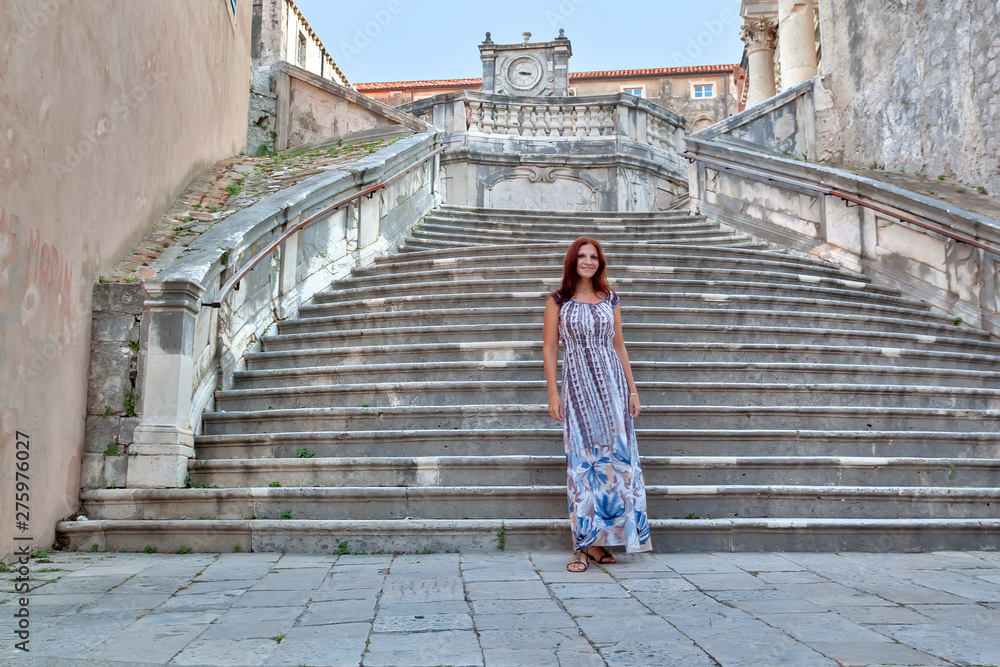 Beautiful girl on vacation. Croatia, Dubrovnik. Stone stair