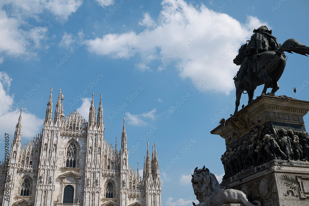 Milan, Italy - April 09 2019: View of Vittorio Emanuele equestrian monument and Duomo on the foreground