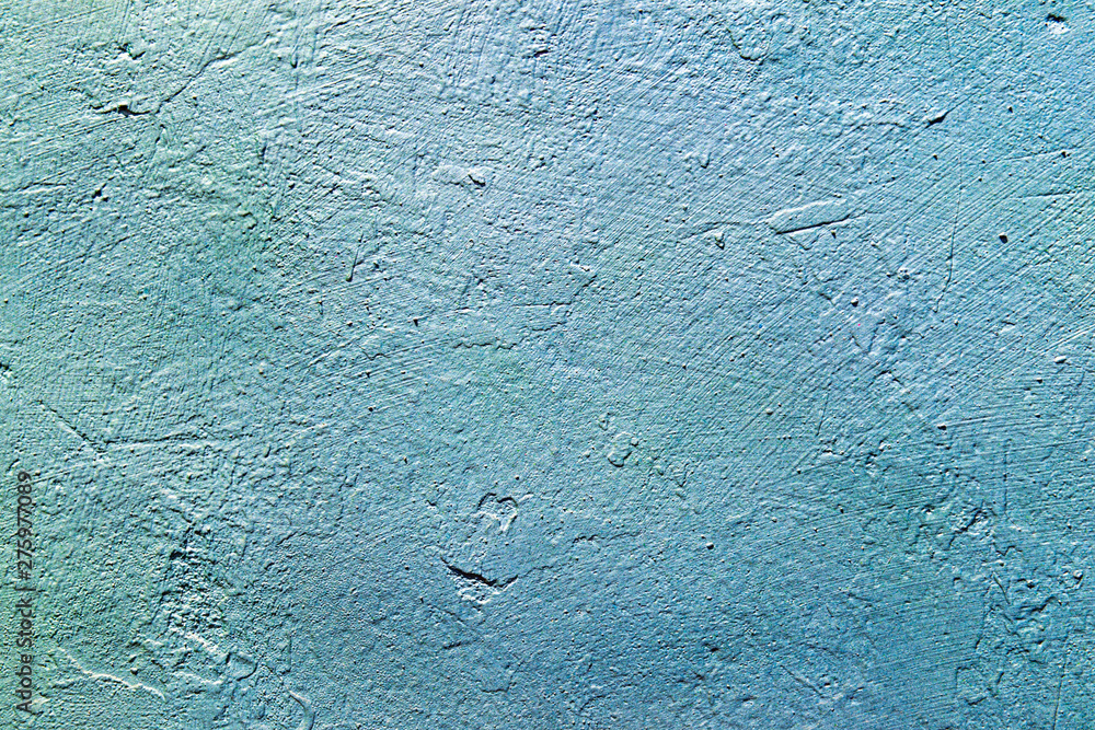 Obraz premium The texture of the concrete wall is blue and azure. Raw plaster wall background. The background of the sea waves.