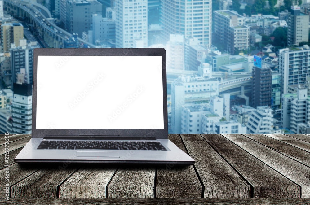 laptop notebook computer with white blank space screen on wooden desk with modern cityscape background, advertisement, workstation, internet technology, online social media, searching data concept laptop notebook computer with white blank space screen on wooden desk with modern cityscape background, advertisement, workstation, internet technology, online social media, searching data concept