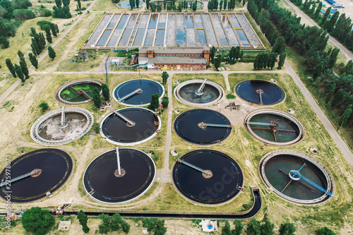 Aerial view of wastewater treatment plant. Dirty water cleaning facilities. Sewage purification