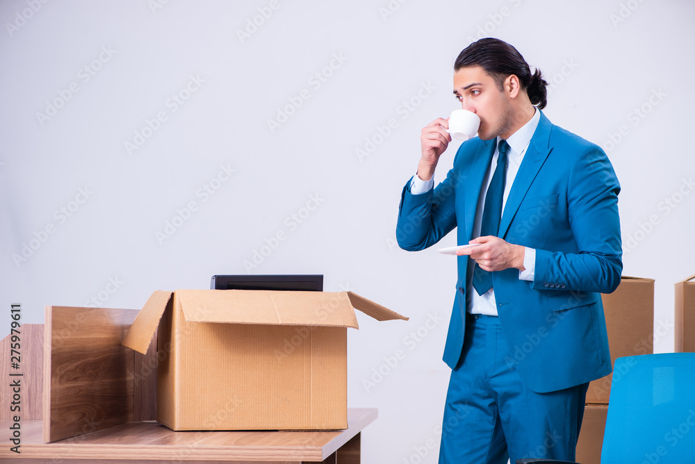 Young handsome businessman being fired from his work Young handsome businessman being fired from his work