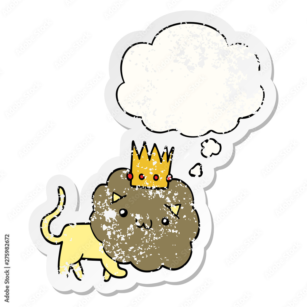 Fototapeta premium cartoon lion with crown and thought bubble as a distressed worn sticker