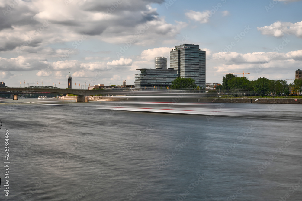 A long exposure photo from a fast-moving ship on the Rhine in cologne.