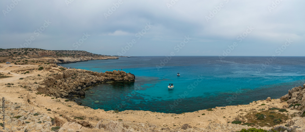 CYPRUS, CAPE CAVO GRECO - MAY 11/2018: Tourists sailed on a motor boat into the blue lagoon for swimming.