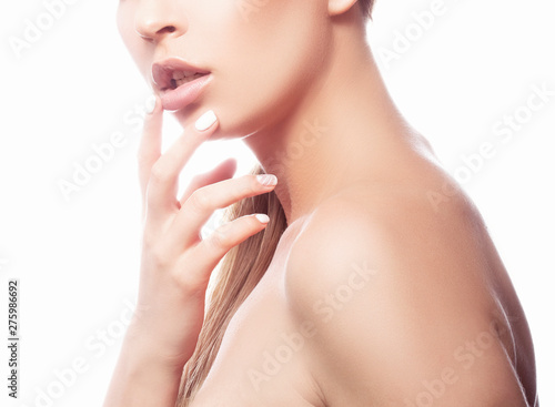 Lips  hand  shoulder of girl with healthy skin. Partial portrait of beauty young woman. Spa skincare facial treatment body care concept. White background