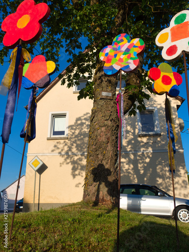 A decorative flower made of wood and from children for summertime photo