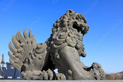 giant lion sculptures under blue sky, tangshan city, China © junrong