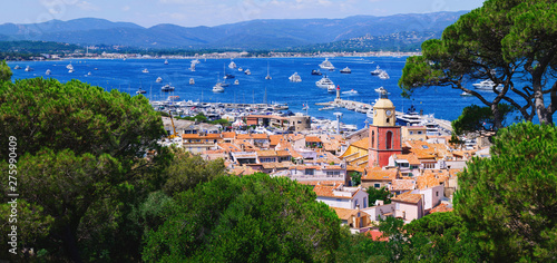 View to saint-tropez city from sea with luxury yacht photo