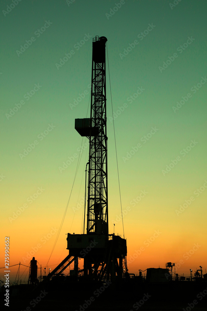 Oil drilling derrick in oilfield