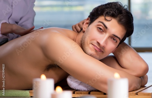 Young handsome man during spa procedure