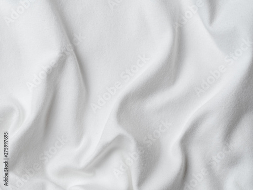 White cotton fabric texture. Clothes cotton jersey background with folds
