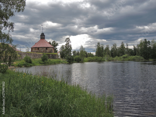 Ancient medieval fortress Korela on an island in the middle of the river Vuoksi on a summer day