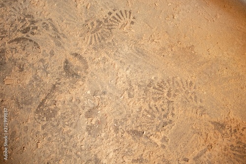 Shoe sole marks on the sand 