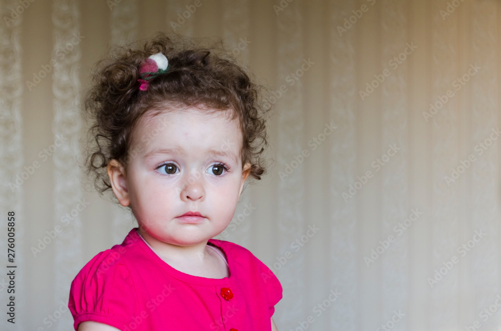 portrait of surprised cute little girl looking into the camera. portrait of surprised cute little girl looking into the camera.