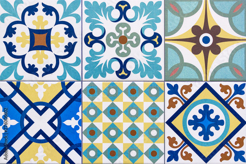 Detail of traditional portuguese tiles with colorful ornaments. Horizontal background. Detail of traditional tiles from the facade of an old house in Porto, Portugal. Traditional Portugal pottery.