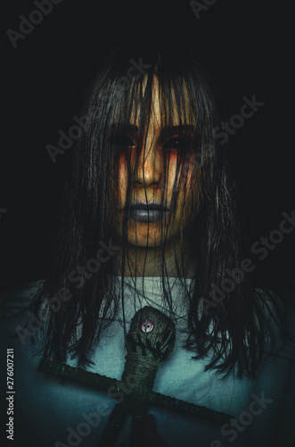 Canvas-taulu Creepy witch with voodoo doll on black background