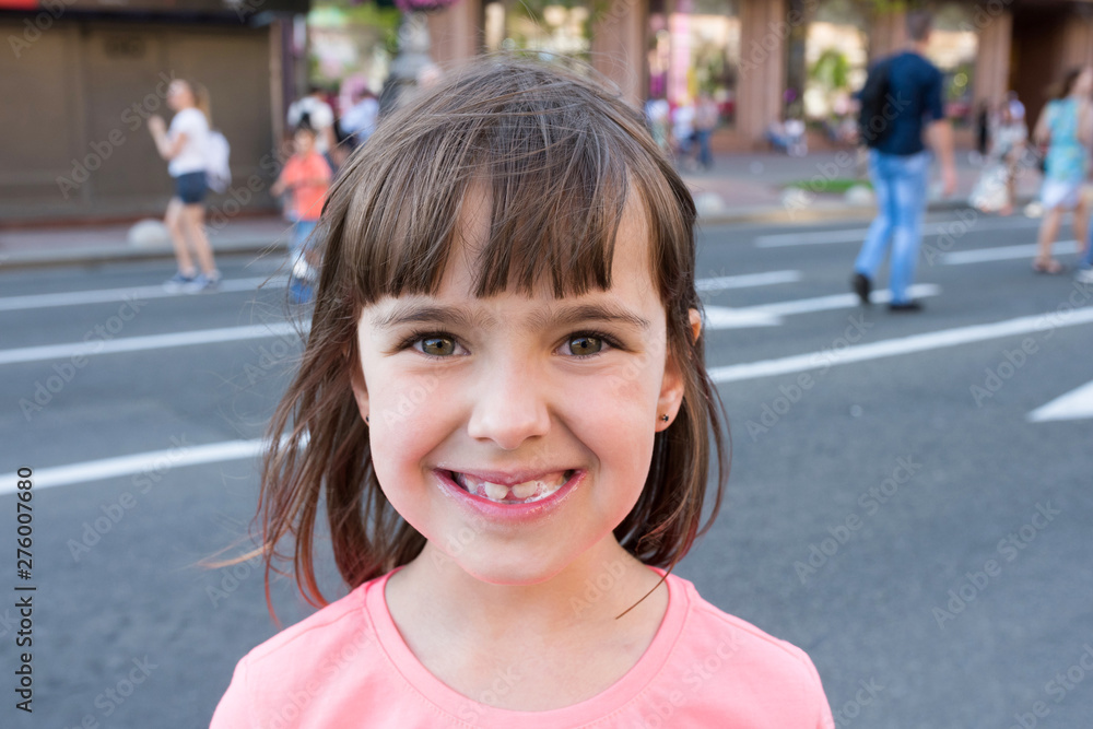 Outdoor portrait of a girl smeared in ice cream. Close-up Outdoor portrait of a girl smeared in ice cream. Close-up