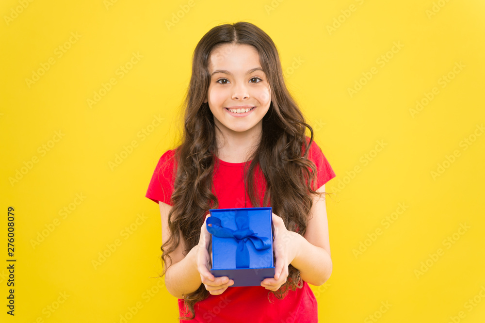 Happy birthday to you. Birthday girl. Happy little child holding birthday gift on yellow background. Adorable small kid celebrating birthday Happy birthday to you. Birthday girl. Happy little child holding birthday gift on yellow background. Adorable small kid celebrating birthday
