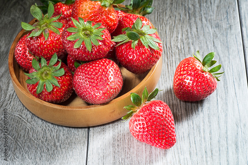 strawberries in wooden cup