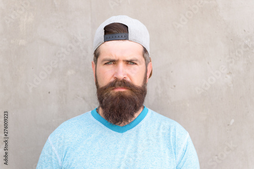 Beard and mustache grooming. Hipster lifestyle. Cool hipster with beard wear stylish baseball cap. Brutal handsome mature hipster man. Bearded man trendy style. Barber salon and facial hair care