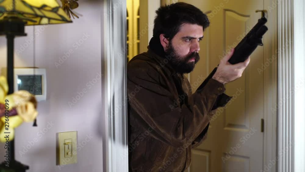 man with shotgun patrolling house man with shotgun patrolling house