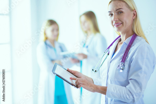 Medical equipment: blue stethoscope and tablet on white background. Medical equipment