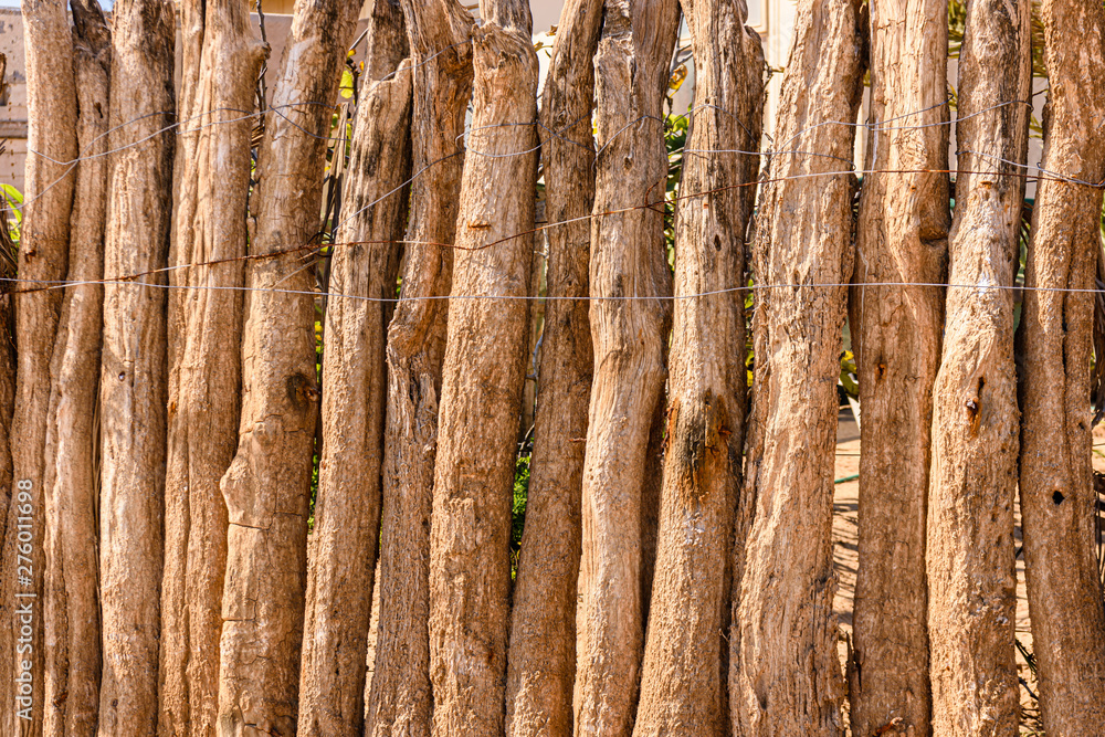 Rustic wooden fence around a house in Namibia Rustic wooden fence around a house in Namibia