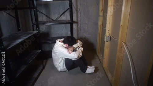 Man locked away in a closet kidnapping concept