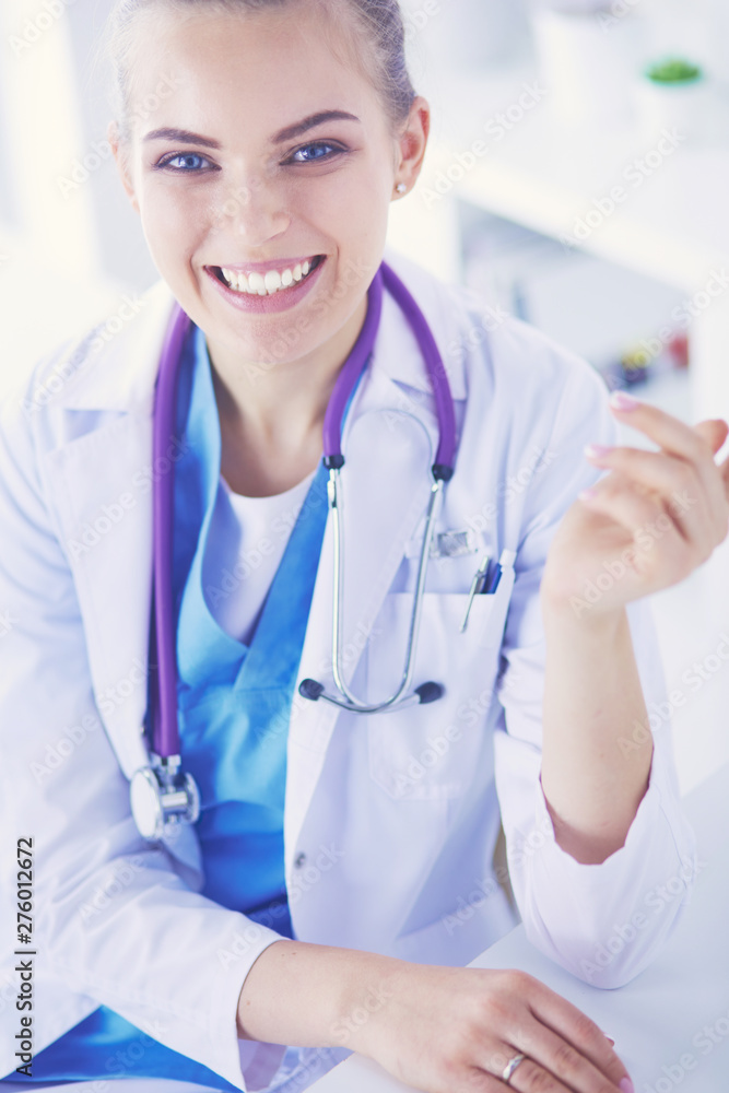 Close up Portrait of friendly female doctor with stethoscope and tablet in hands. Close up Portrait of friendly female doctor with stethoscope and tablet in hands.