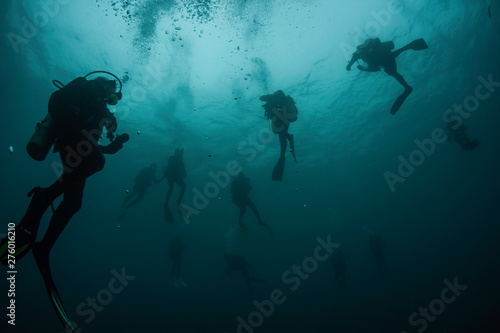 Divers ascend from the deep after a dive in the beautiful waters of Grenada, West Indies, in the Caribbean Sea.