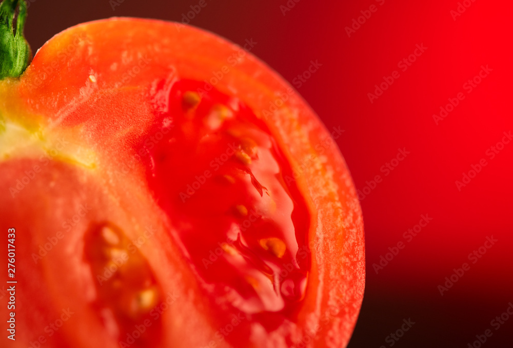 Tomato. Ripe natural tomatoe closeup. Organic tomato on red background. Half of Tomato close-up. Gardening concept Tomato. Ripe natural tomatoe closeup. Organic tomato on red background. Half of Tomato close-up. Gardening concept