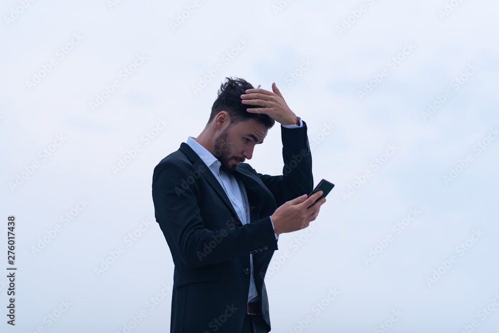 businessman using smartphone, with black suit businessman using smartphone, with black suit
