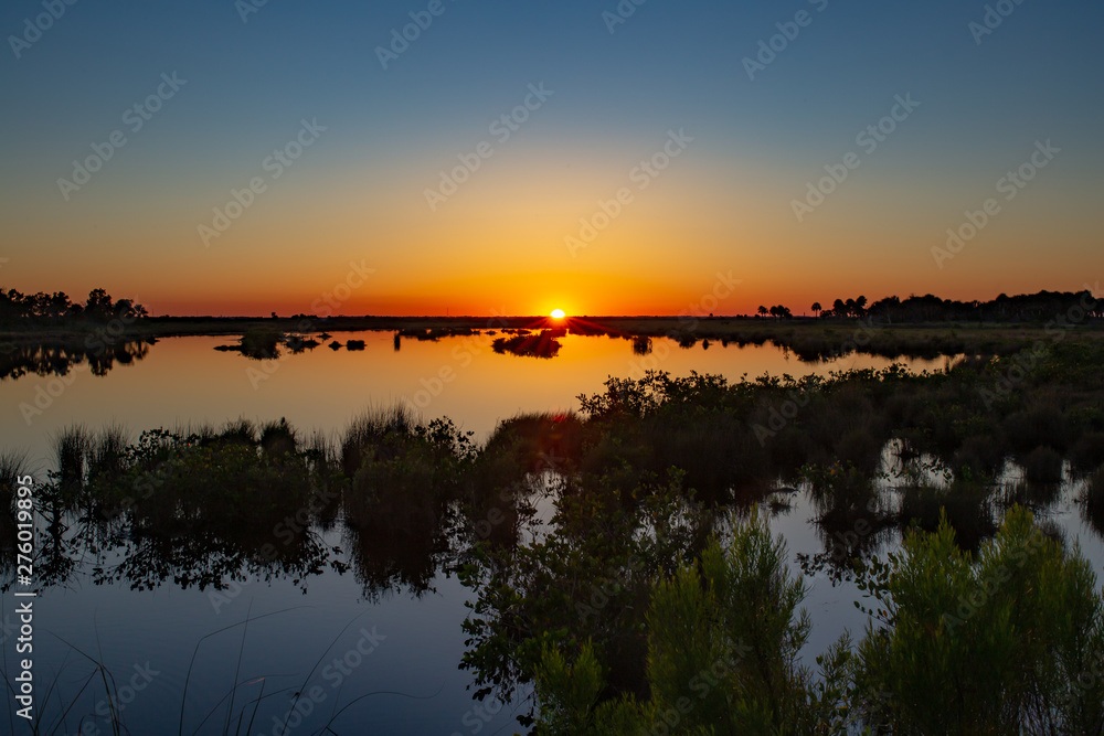 Stunning Spring sunset over marshland and mudflats of the Florida Everglades.. 